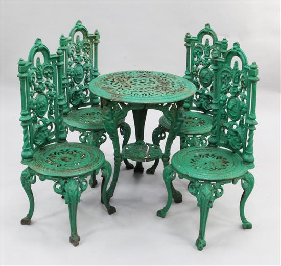 A set of four Victorian garden chairs & a table